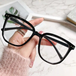 Lunettes rectangulaires à monture noire brillante, conçues pour un style professionnel et moderne, idéales pour le travail ou les études - Milanoza